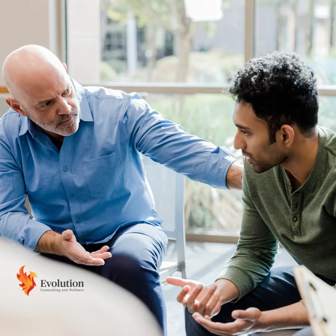 Younger man empathizing with an older man