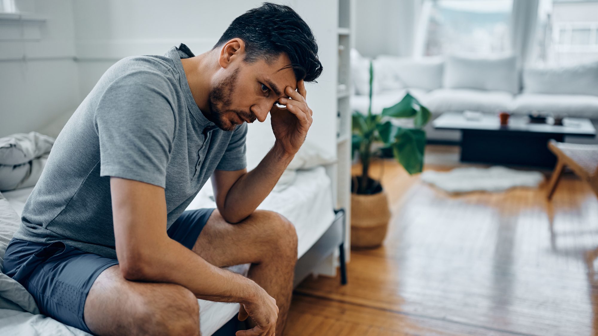 Man sitting alone while emotionally numb