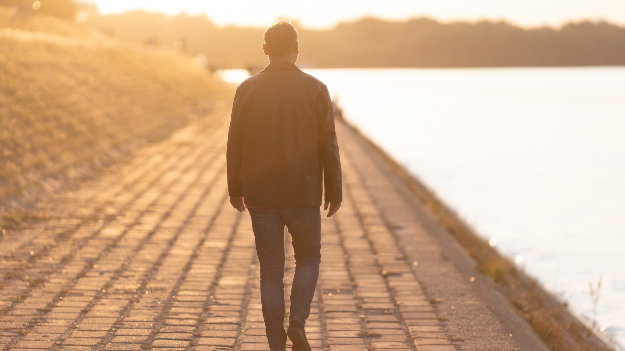Man walking alone while feeling lost in life